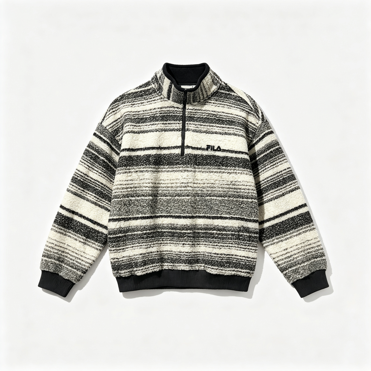 A Fila quarter-zip fleece pullover sweater with horizontal black, gray, and off-white stripes, featuring a black ribbed collar, cuffs, and hem, and a small black Fila logo on the left chest.