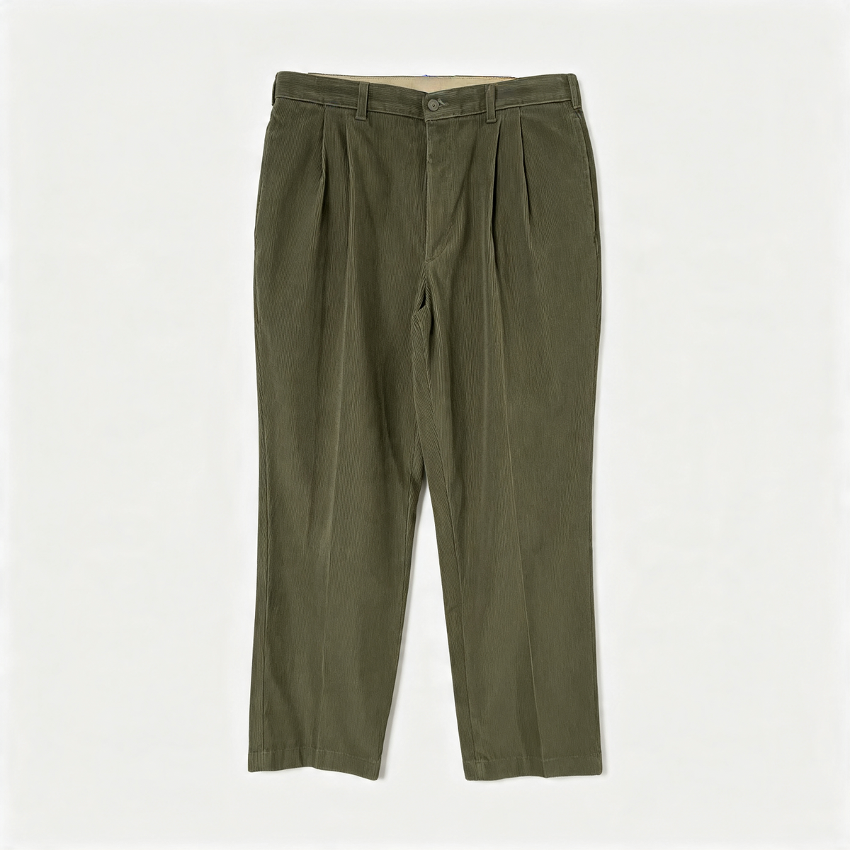 Olive green corduroy pleated trousers laid flat against a light off-white background.