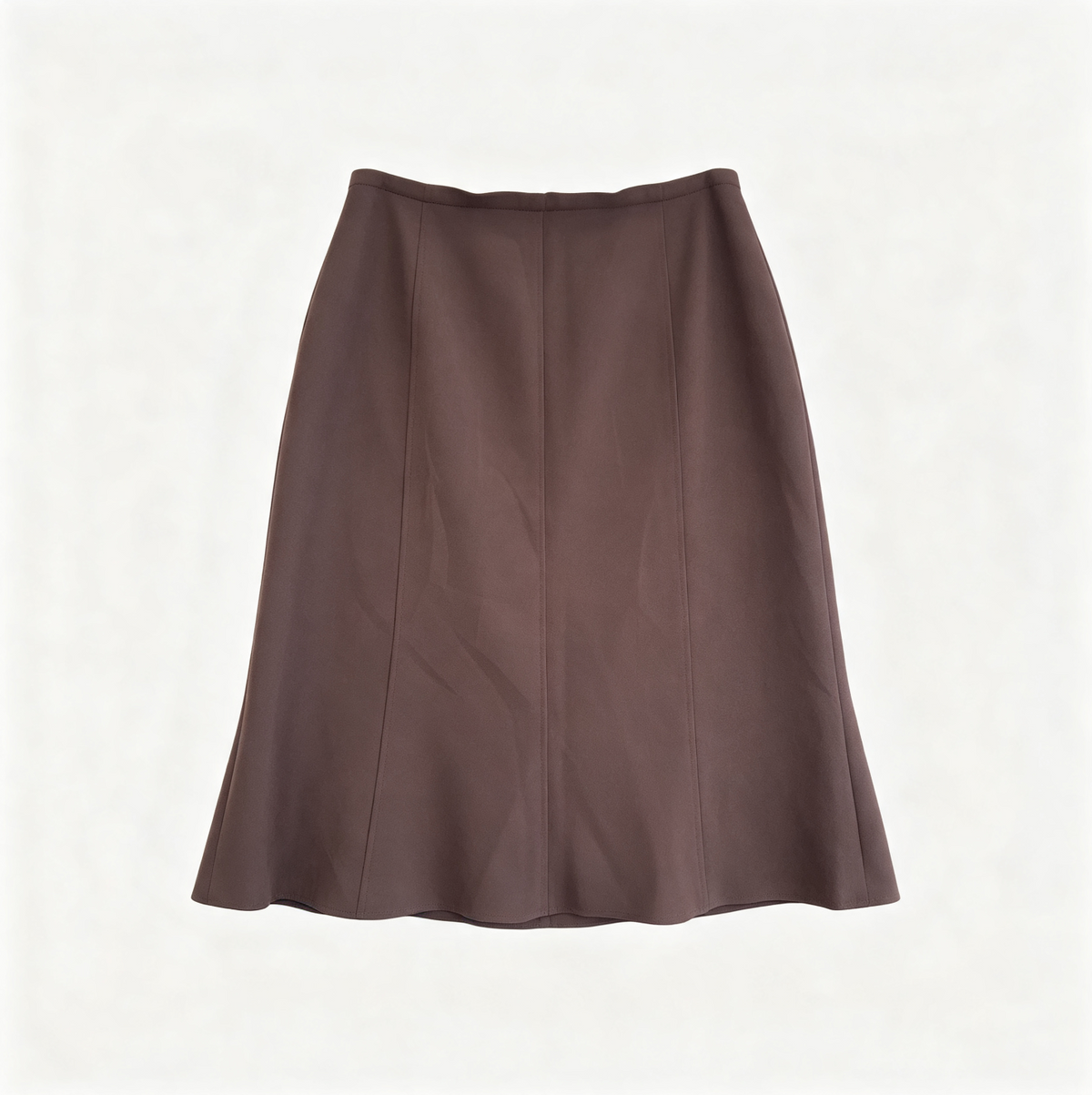 A brown A-line skirt with a straight waistband, laid flat against a light off-white background.