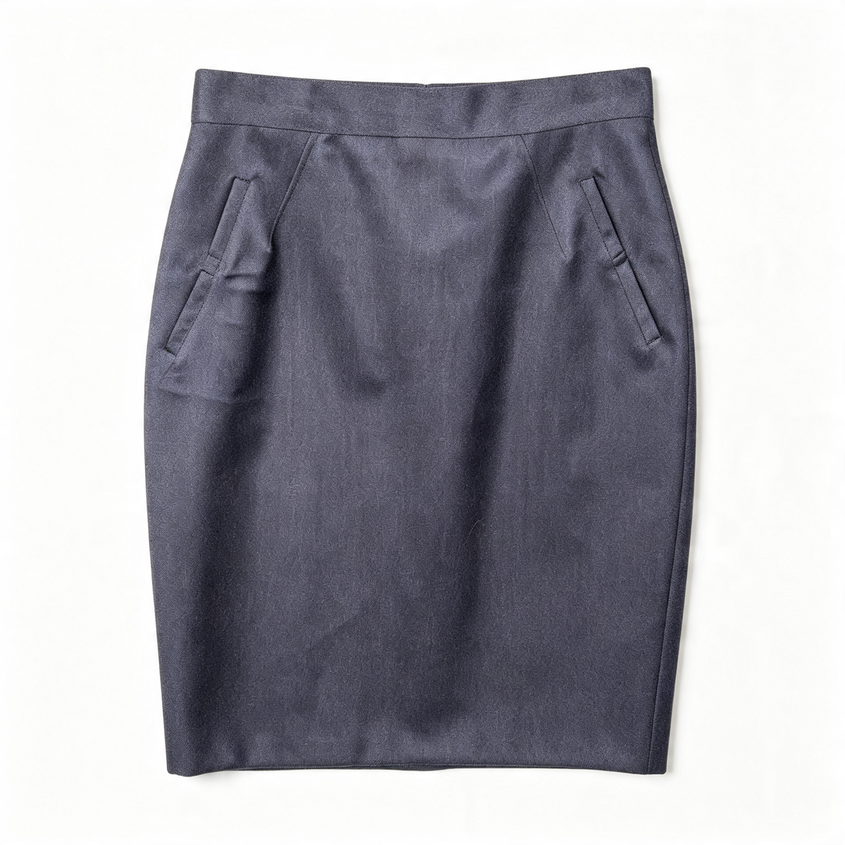 A dark slate blue wool pencil skirt with side pockets, laid flat against a white background.