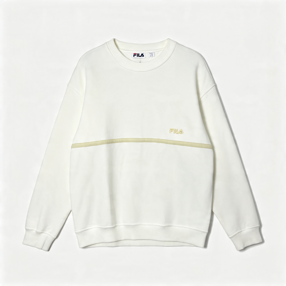 An off-white crewneck sweatshirt by FILA, featuring a horizontal light beige stripe across the chest and a small gold FILA logo on the left chest.