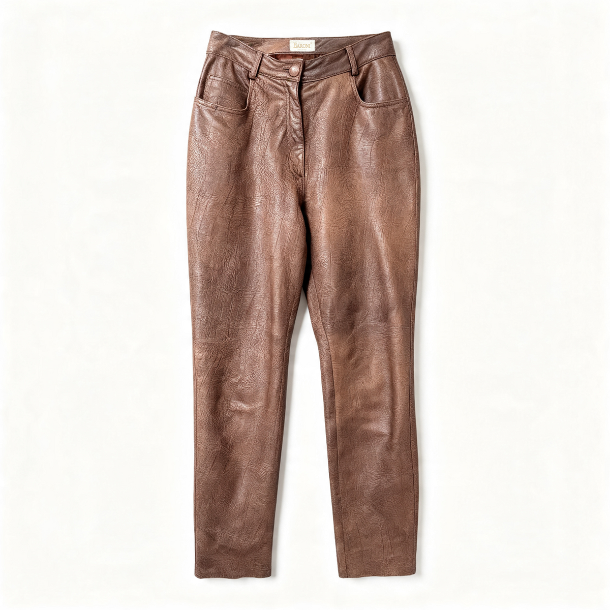 A pair of brown leather pants with a high waist, button closure, and front pockets, laid flat against a white background.