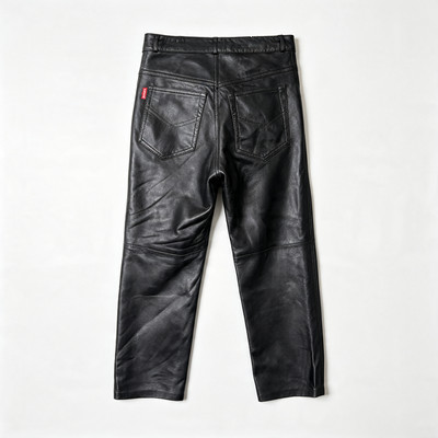 Black leather pants shown from the back, featuring a wide waistband, stitched pocket details, and a small red brand tab on the left pocket, laid flat on a white background.