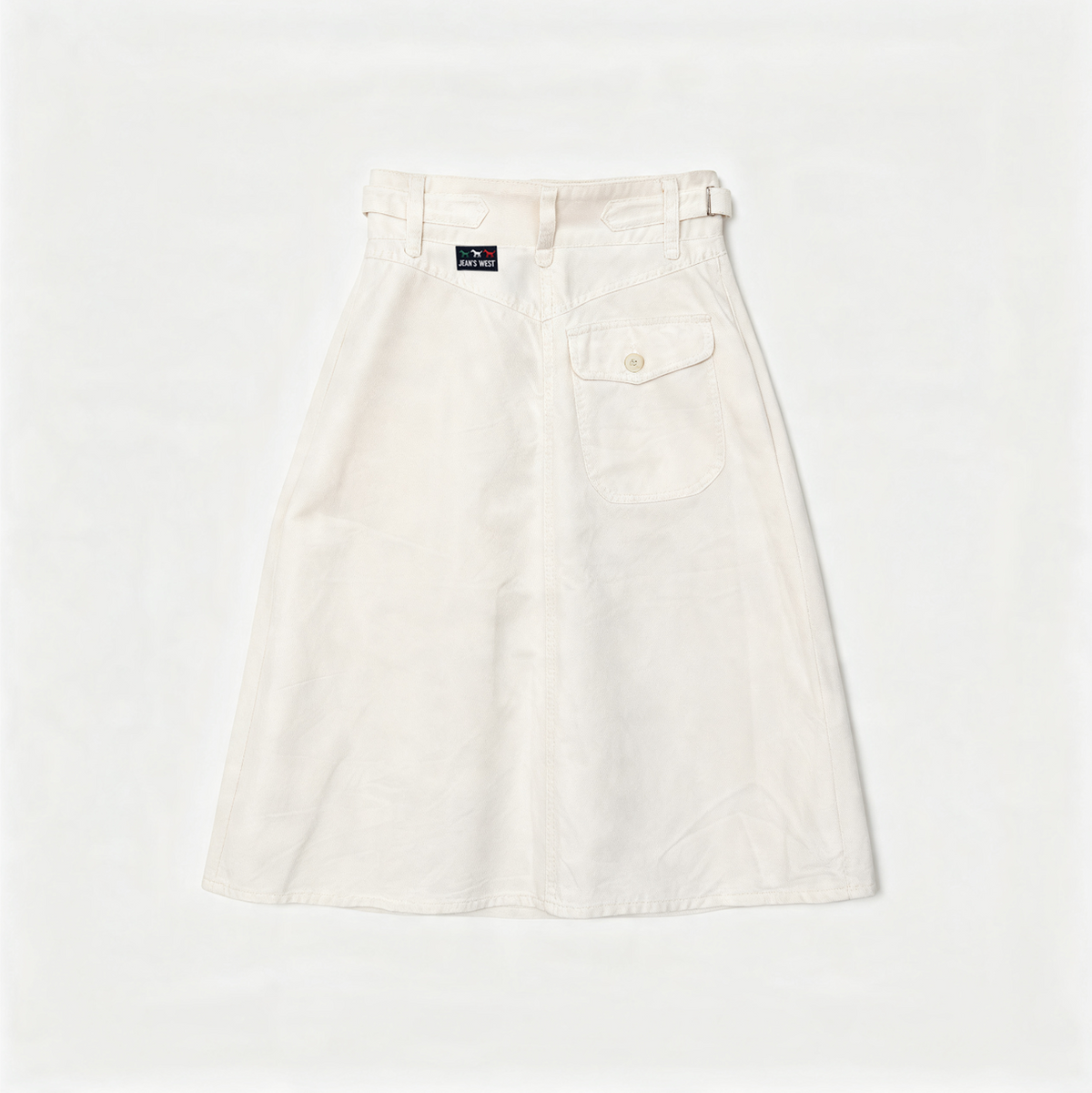 An off-white A-line skirt with a button fly, belt loops, and a buttoned flap pocket on the right side, laid flat against a white background.