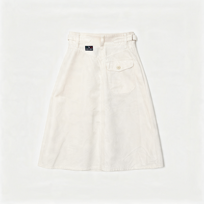 An off-white A-line skirt with a button fly, belt loops, and a buttoned flap pocket on the right side, laid flat against a white background.
