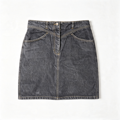 A dark gray mineral-wash denim mini skirt with a button closure, belt loops, and front slash pockets, laid flat on a white background.
