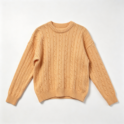 A light peach cable-knit crewneck sweater laid flat against a clean white background.