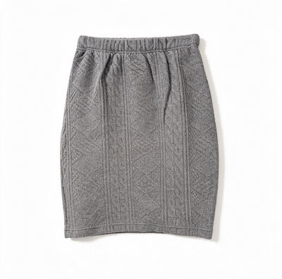A gray knit skirt with a textured cable pattern, featuring an elastic waistband, laid flat on a white background.