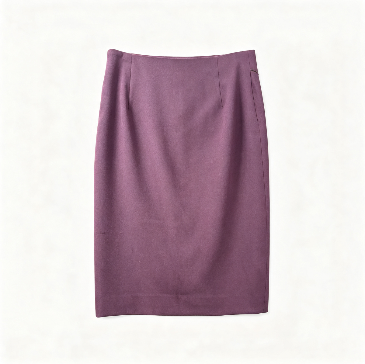 A solid purple knee-length pencil skirt with a structured waistband, laid flat against a light off-white background.