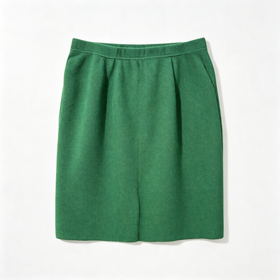 A green pleated skirt with a wide waistband, laid flat against a clean white background.