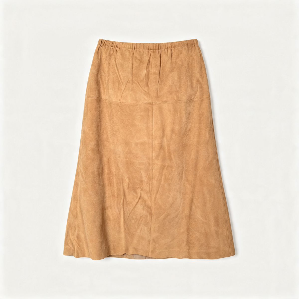 A tan suede A-line midi skirt with an elastic waistband, laid flat against a light off-white background.