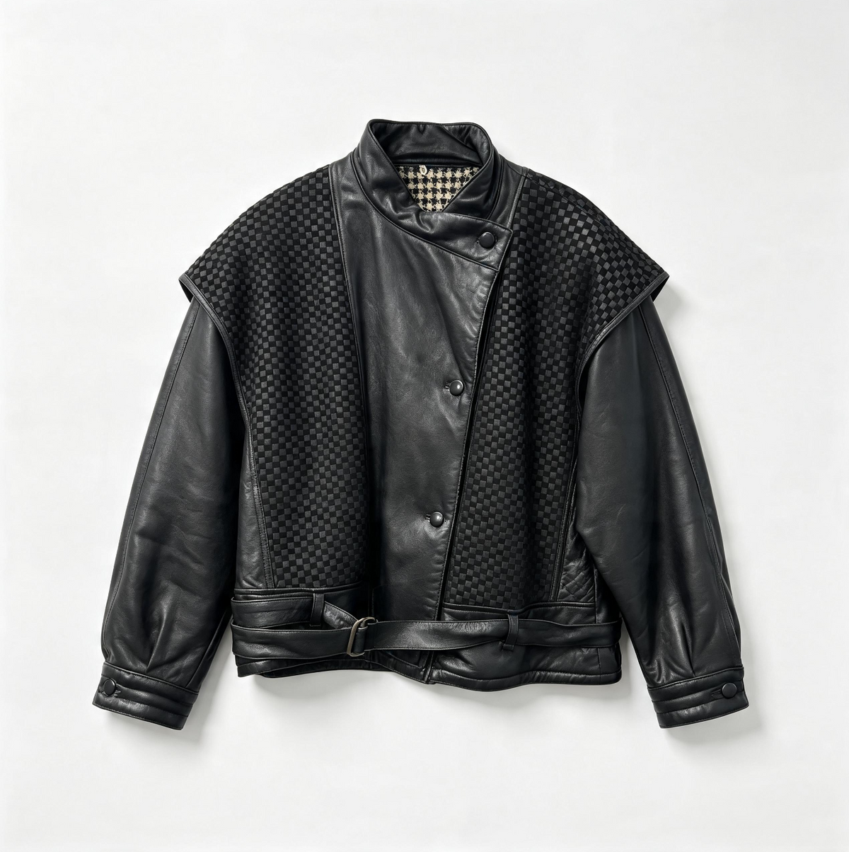 A black leather jacket with textured woven panels on the shoulders and front, black leather sleeves, and a matching black leather belt, shown flat against a light gray background.
