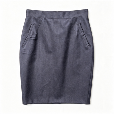 A dark slate blue wool pencil skirt with side pockets, laid flat against a white background.